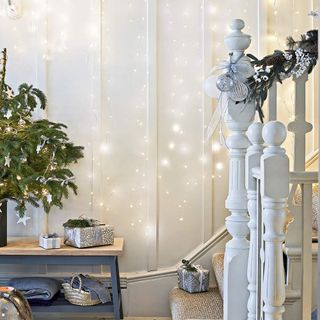 white staircase with hanging fairy lights