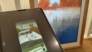 Vieunite Textura Digital Canvas review; an iPad held in front of a digital picture frame