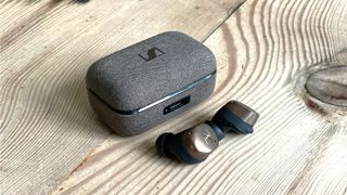 Sennheiser Momentum True Wireless 4 with charging case on table