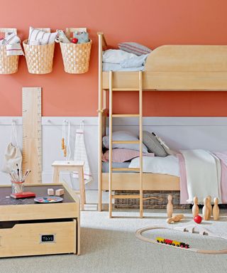 childrens bedroom with carpet, wall storage and wooden bunk bed