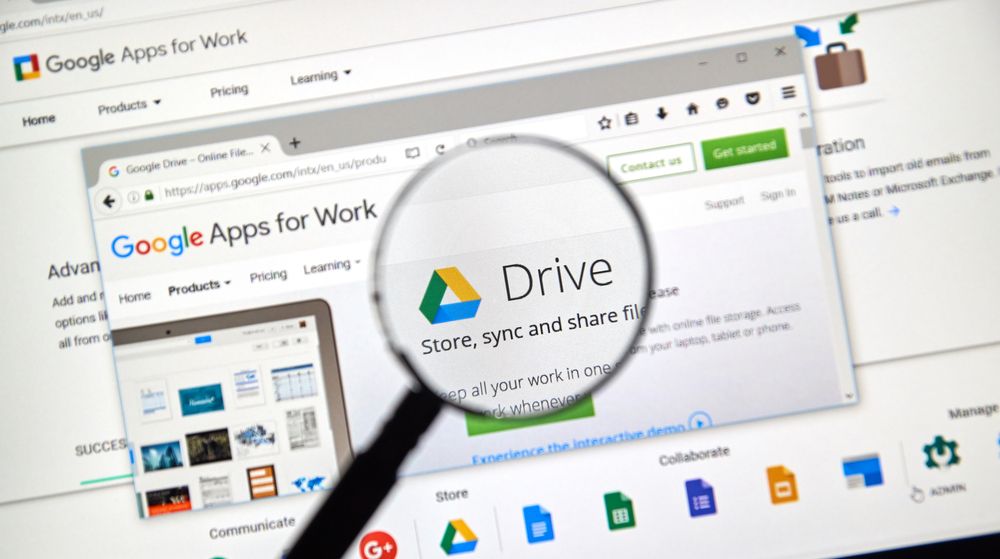 G Suite on laptop under a magnifying glass