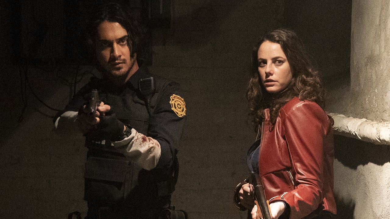 Avan Jogia's Leon Kennedy and Kaya Scodelario's Claire Redfield prepare to shoot some zombies in Resident Evil: Welcome to Raccoon City