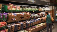  Customers shop in the produce section at an Aldi grocery store on June 12, 2017 in Chicago, Illinois