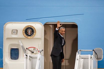 President Obama boards Air Force One in his international farewell tour