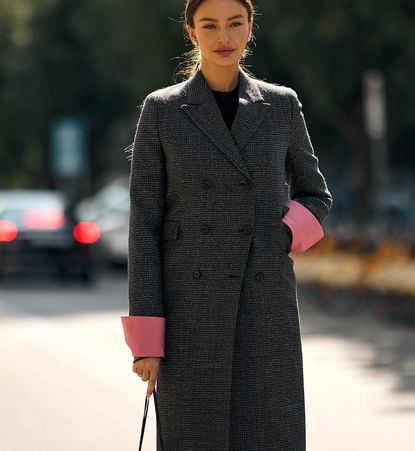 woman wearing a coat in milan