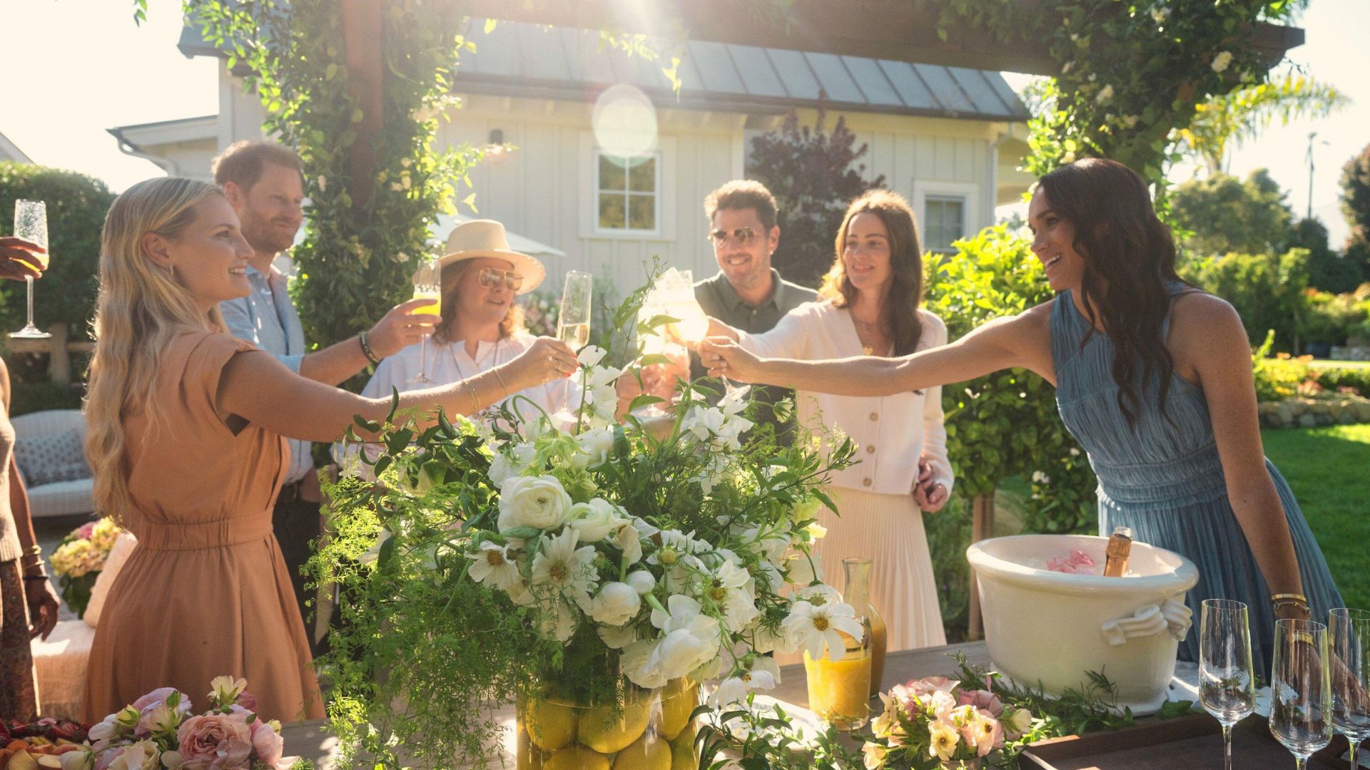 Meghan Sussex toasts a glass of bubbly over brunch with friends and family