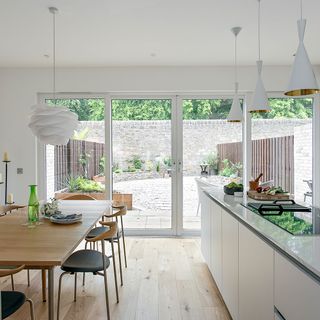beautiful kitchen with attached dining area and galary