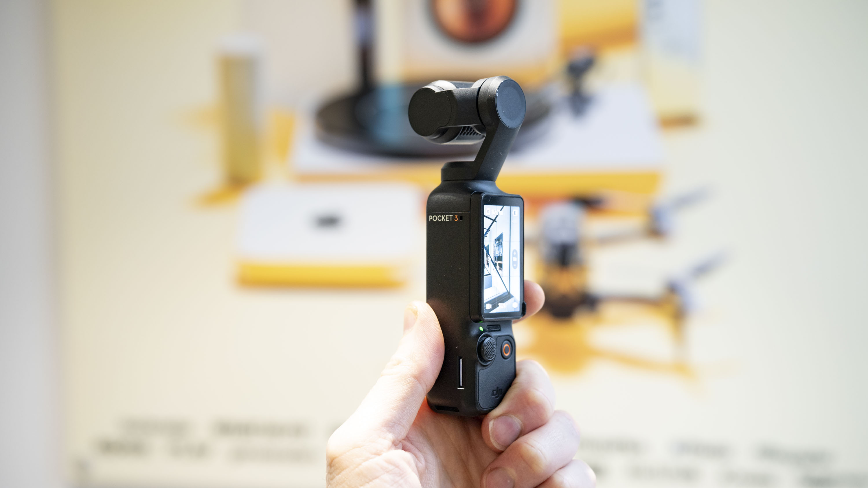 DJI Osmo Pocket 3 vlogging camera in user's hand
