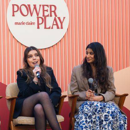 Two panelists from Marie Claire's Power Play event sitting on a stage
