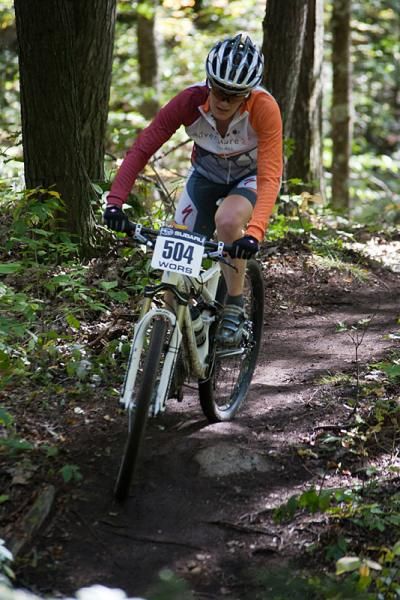 Lisa Krayer (Adventure 212 / Specialized) chases alone in the singletrack at WORS Bear Paw.