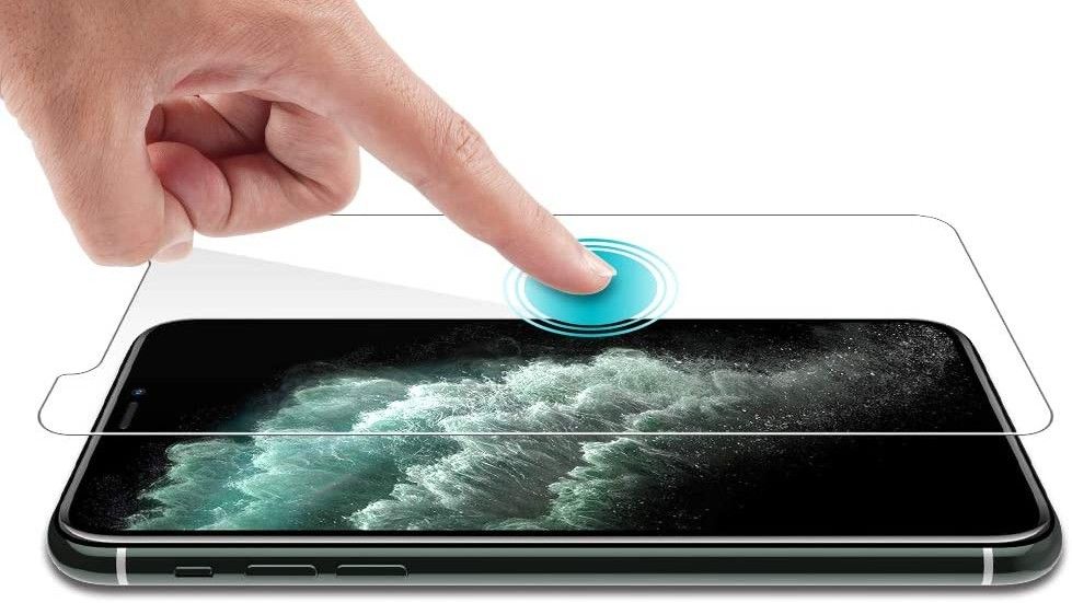 best iPhone screen protector: Hand pressing LK screen protector onto iPhone