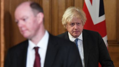  Boris Johnson and Chief Medical Officer Chris Whitty arrive for a Covid-19 media briefing
