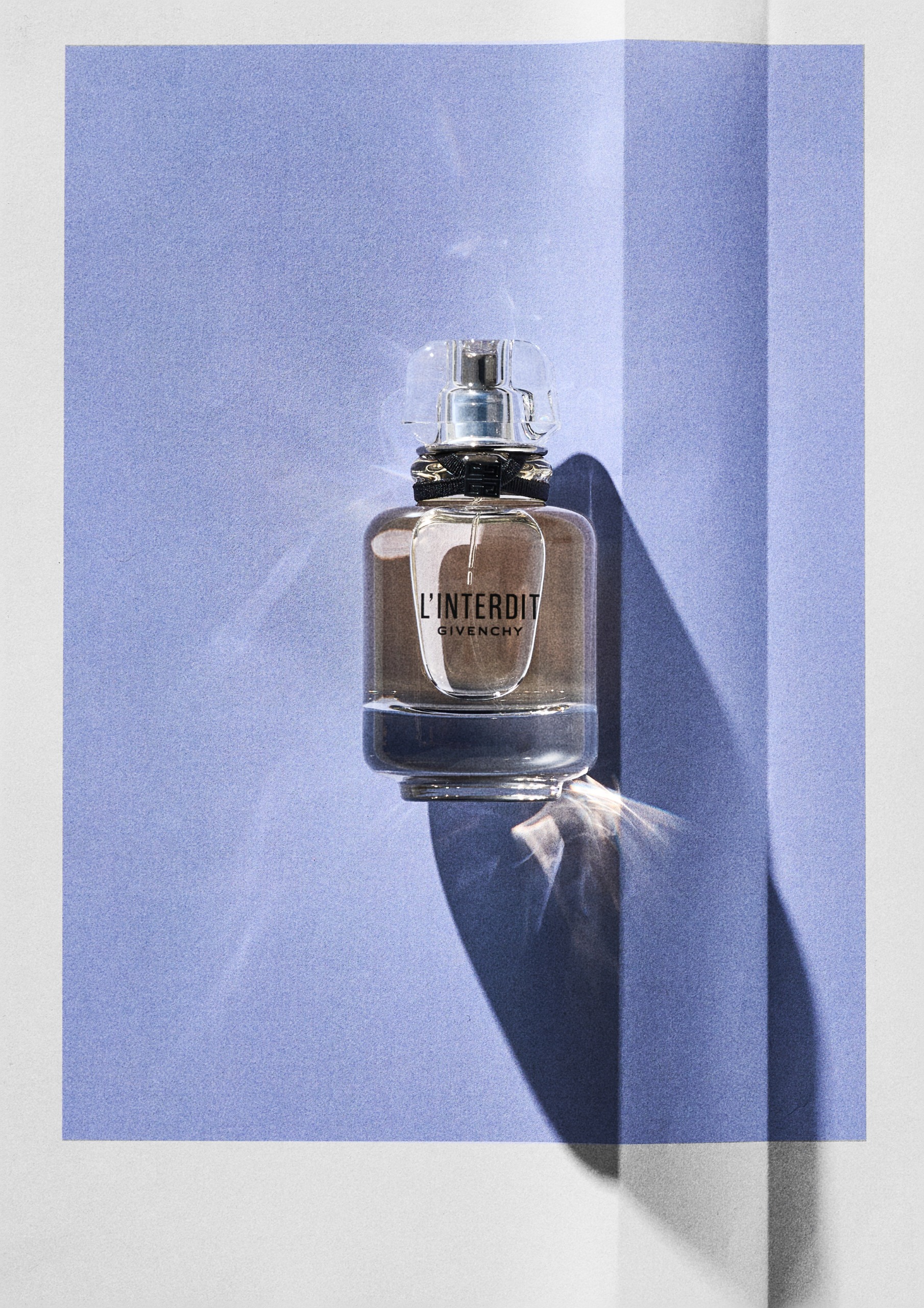 Givenchy L'Interdit on a blue background