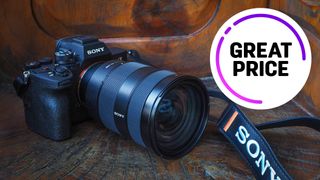 Sony A7 IV, with 24-70mm lens, sitting on a wooden surface with the text "Great price" 