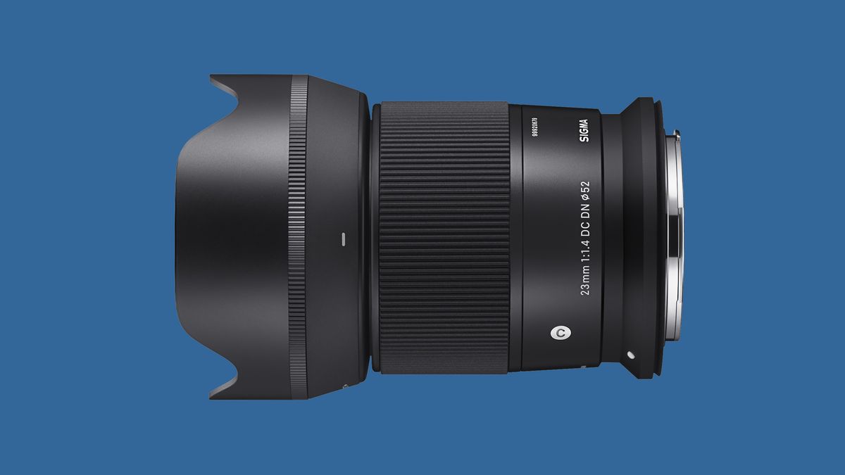 The Sigma 23mm f/1.4 DC DN Contemporary for Canon RF Mount with a blue background