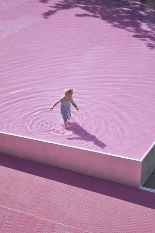 pink architecture pavilion project in melbourne with a child in the middle of the image