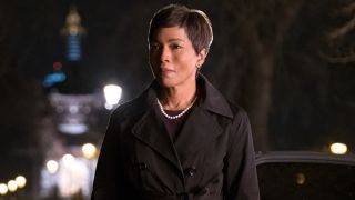 Angela Bassett standing outside in front of a dark car at night in Mission: Impossible - Fallout.