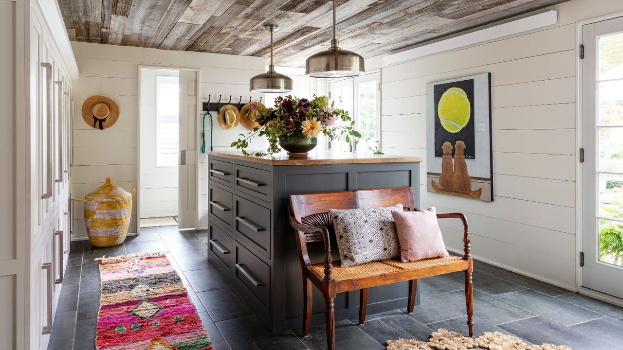 boot room with island and wooden ceiling and tiled flooring