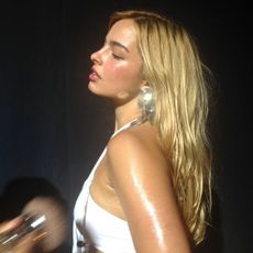 Addison Rae getting her makeup applied.