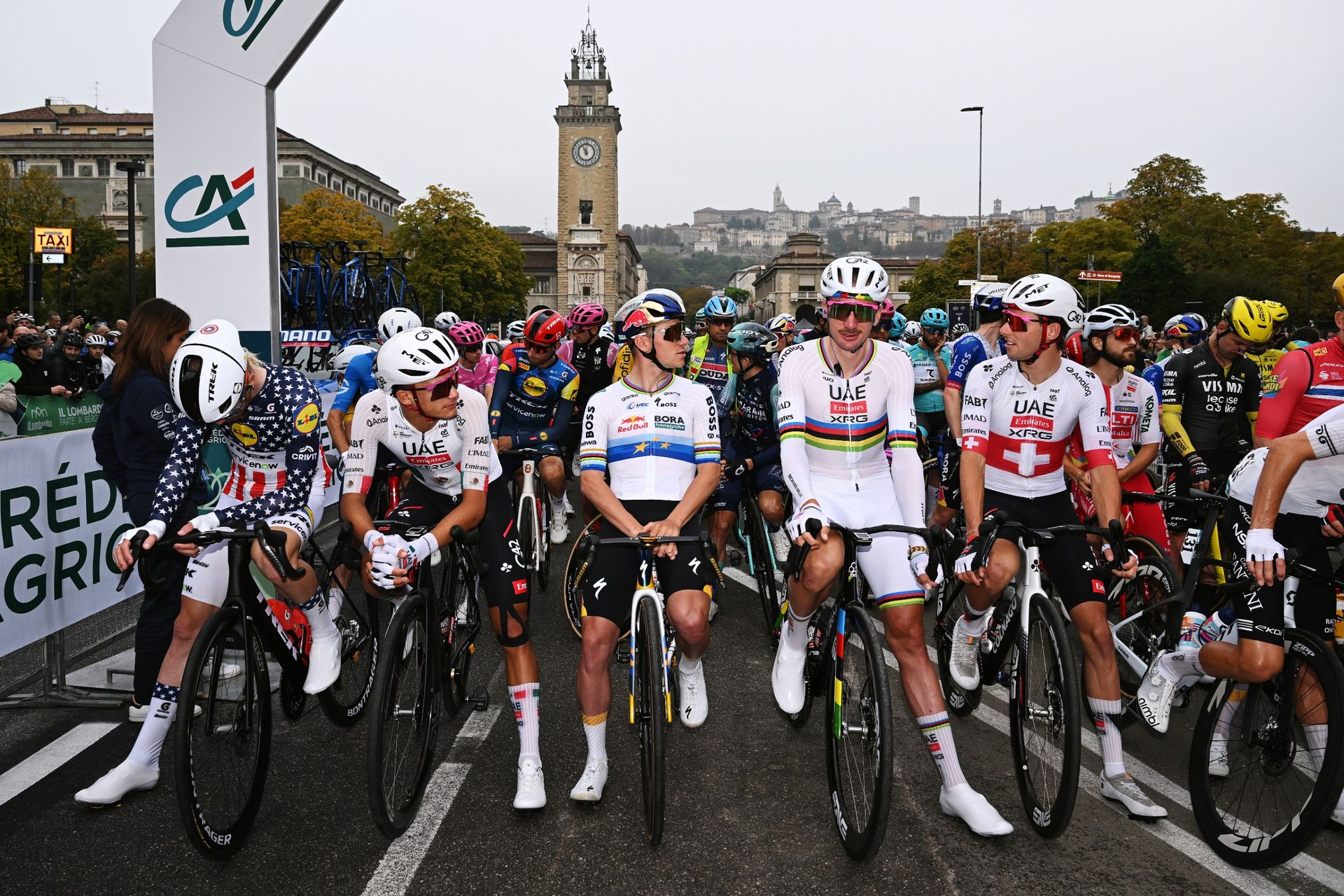 Remco Evenepoel of Team Red Bull - BORA - hansgrohe, the peloton stand in protest against ongoing safety issues within cycling prior to the 120th Il Lombardia 2026