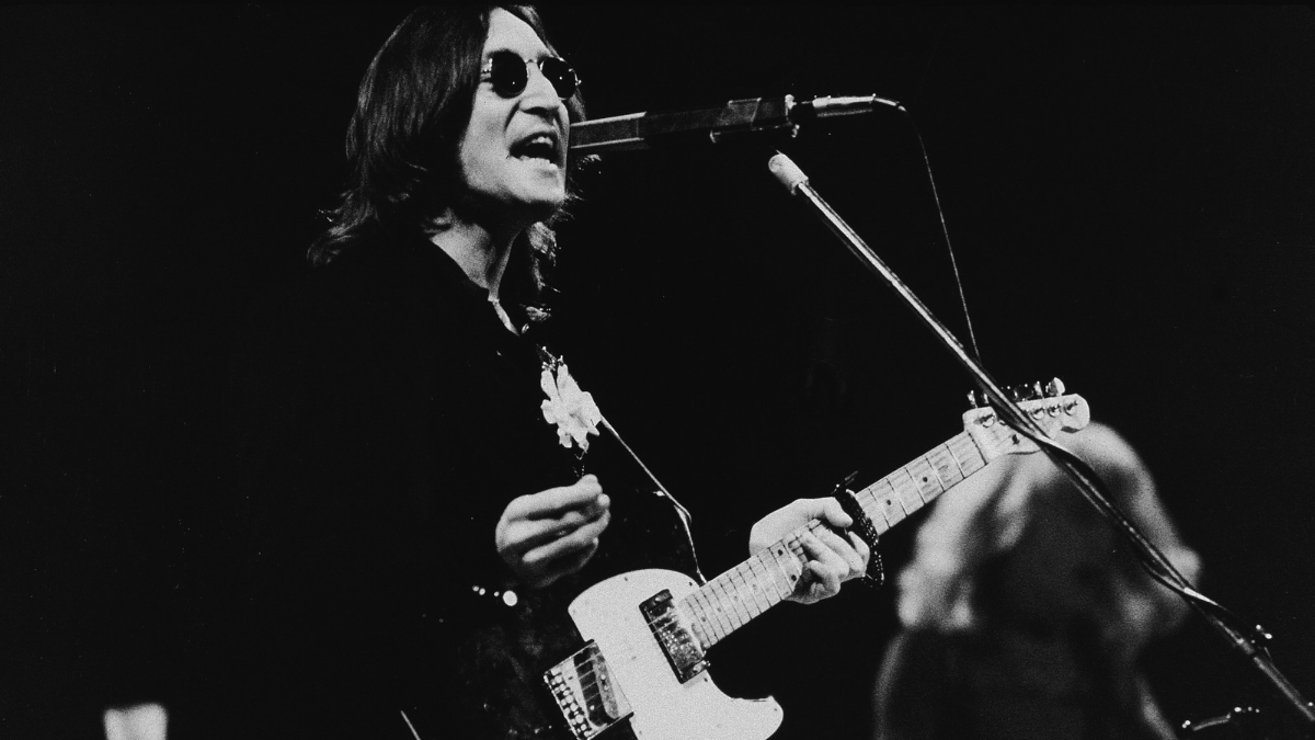 British musician John Lennon (1940 - 1980) performs onstage in Madison Square Garden, New York, New York, November 28, 1974