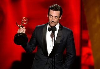 Jon Hamm accepts the award for outstanding lead actor in a drama series for Â“Mad Men (Phil McCarten/Invision for the Television Academy/AP)