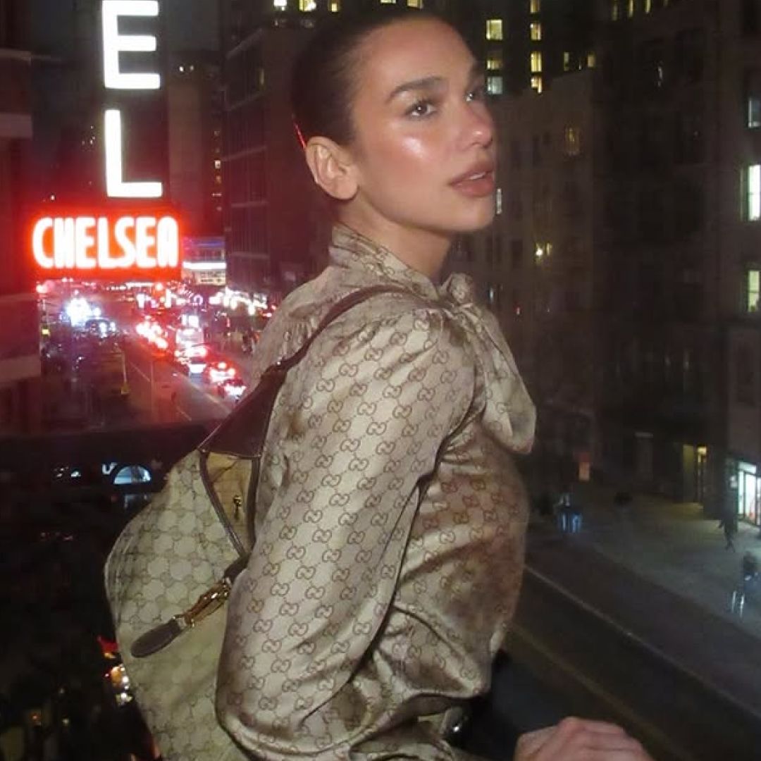 Dua Lipa hosted a Service95 book club event in a monogrammed Gucci Spring 2026 skirt set