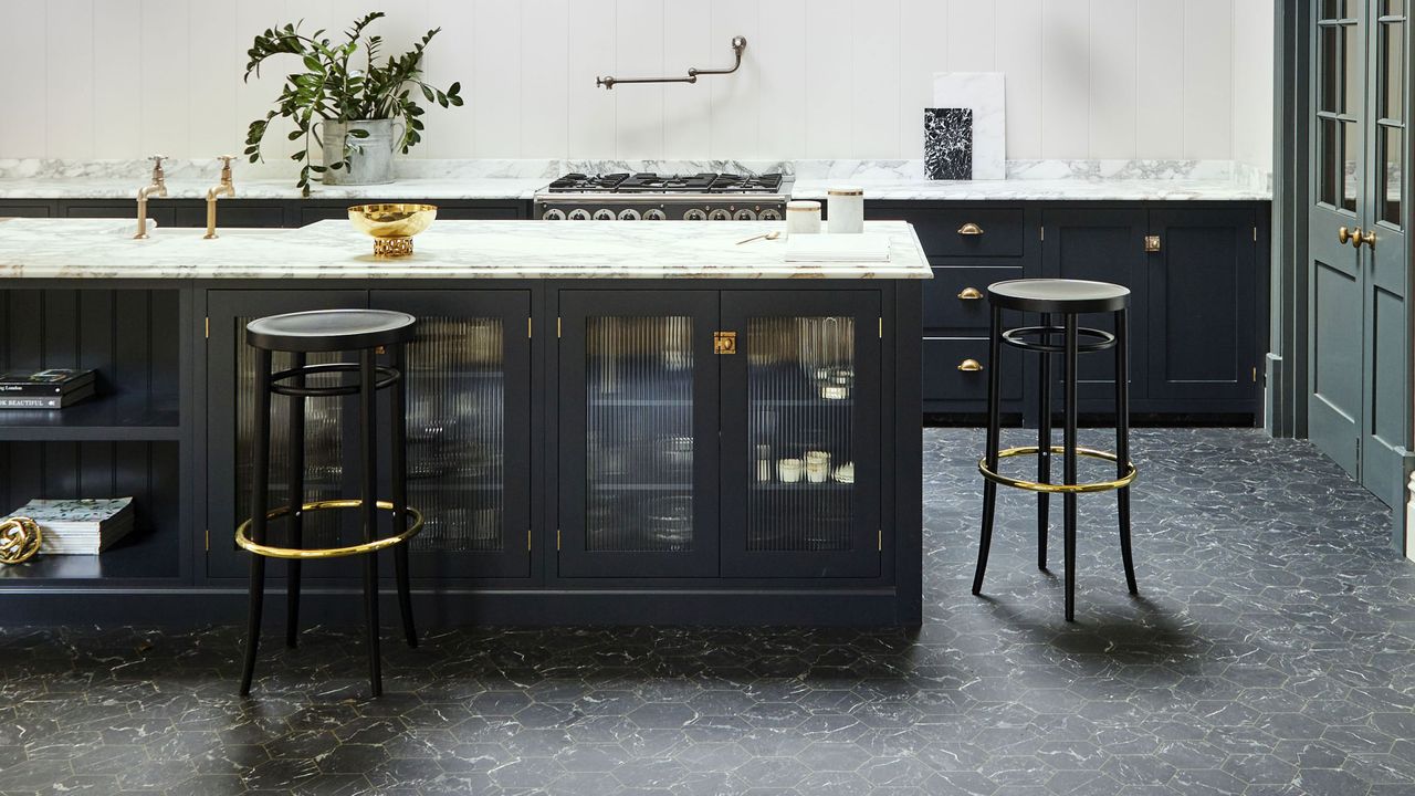 Carpetright Hexagon Black Gold Vinyl tiles in a contemporary kitchen with navy blue cabinetry and ribbed glass