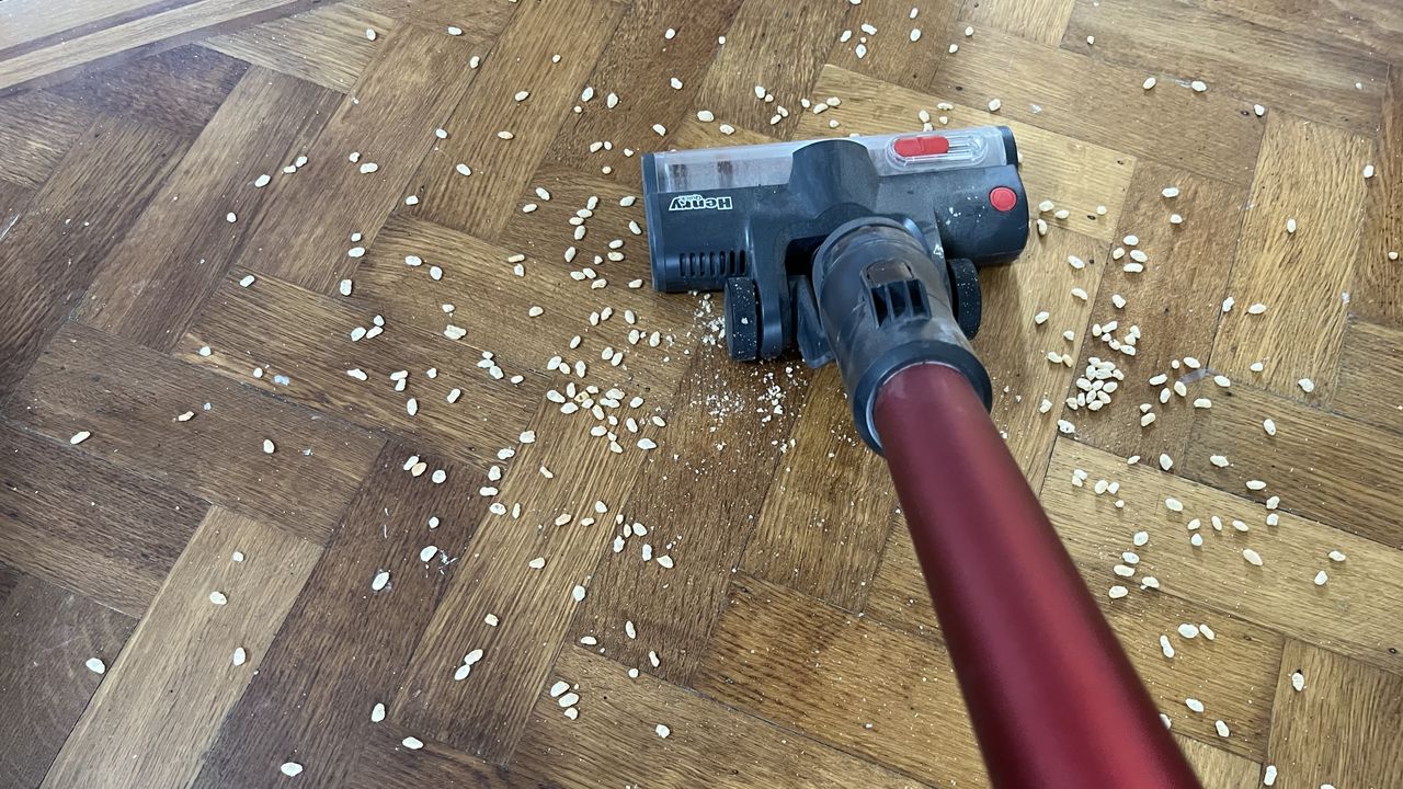 vacuuming oats from hard floor using the henry quick