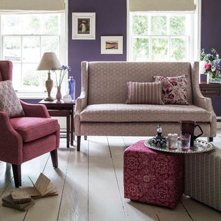 living room with purple walls and sofa set