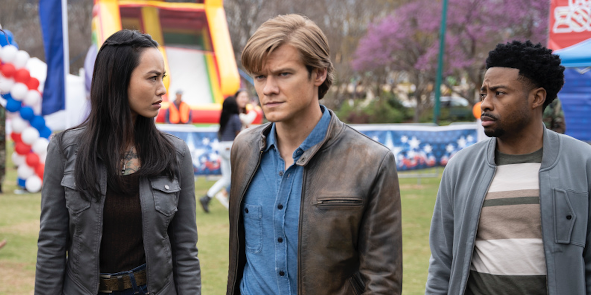 lucas till&#039;s macgyver with partners at a town festival on macgyver