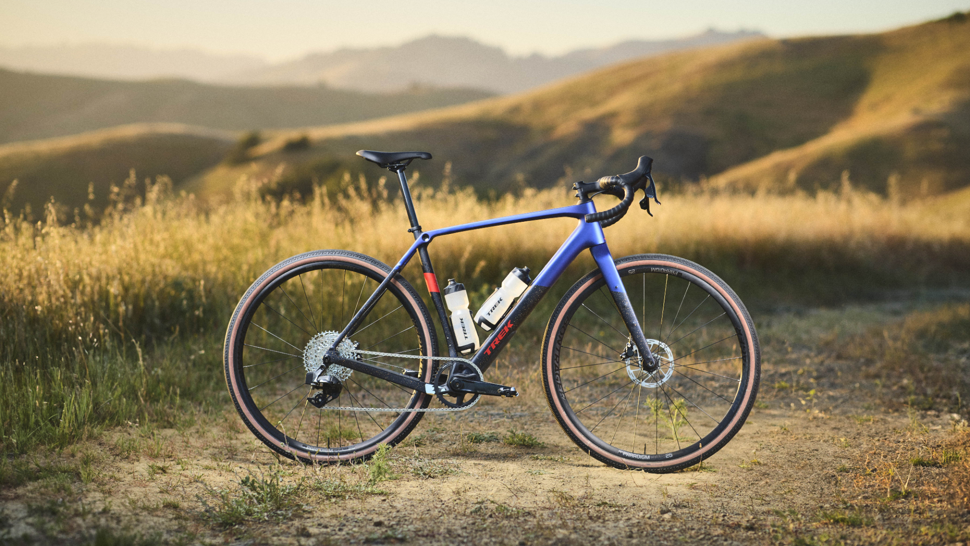 Trek Checkpoint SL 6 AXS Gen 3 pictured with grassy hills in the background