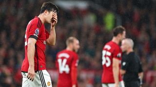 Manchester United's players look dejected after their 3-0 loss at home to Manchester City in the Premier League in October 2023.
