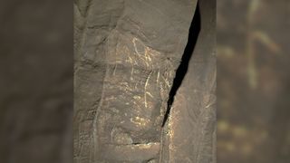 Here we see engravings on a stone cave wall that were possibly made by H. naledi to memorialize the dead.