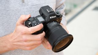 Nikon Z6 III camera held in a pair of hands