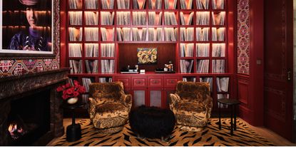 a maximalist library with animal print rug