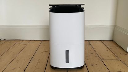 MeacoDry Arete Two 18L Dehumidifier & Air Purifier on the floor in the test room