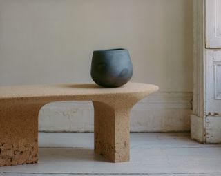 cork furniture with large burnt clay vessel