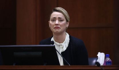 US actress Amber Heard testifies at the Fairfax County Circuit Courthouse in Fairfax, Virginia, on May 5, 2022. - Actor Johnny Depp is suing ex-wife Amber Heard for libel after she wrote an op-ed piece in The Washington Post in 2018 referring to herself as a public figure representing domestic abuse. (Photo by JIM LO SCALZO / POOL / POOL / AFP) (Photo by JIM LO SCALZO / POOL/POOL/AFP via Getty Images)