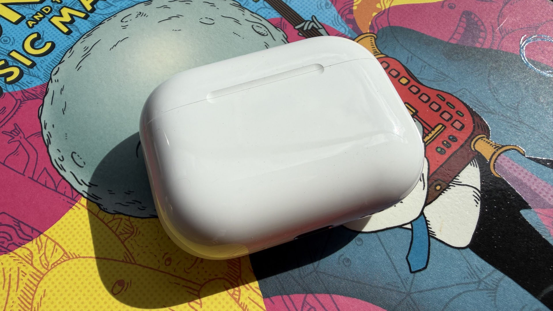 The AirPods Pro 3 earbuds from Apple against the pages of a graphic novel.