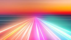 An image showing multicolored strips of light disappearing into the horizon against a sunset, to represent the future of technology in 2026 and beyond.