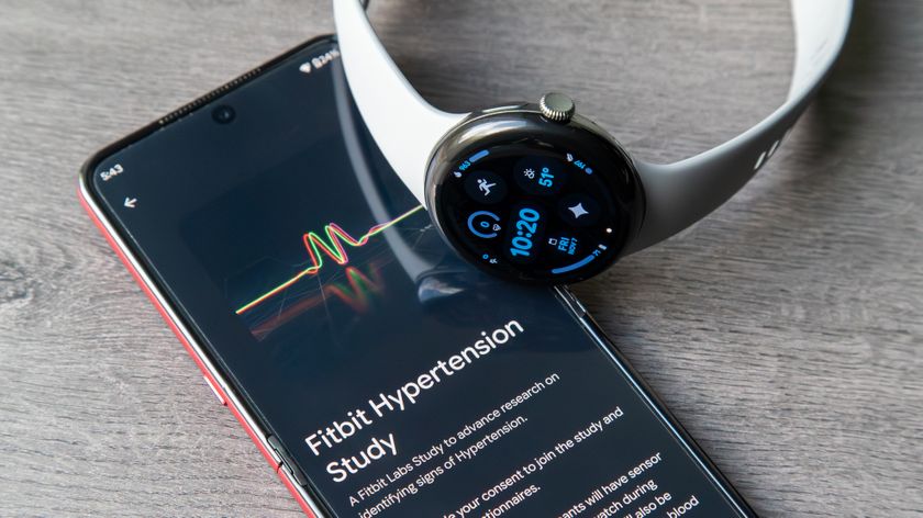 A photo of the Google Pixel Watch 3 sitting atop an Android phone showing a &quot;Fitbit Hypertension Study&quot; from Fitbit Labs.