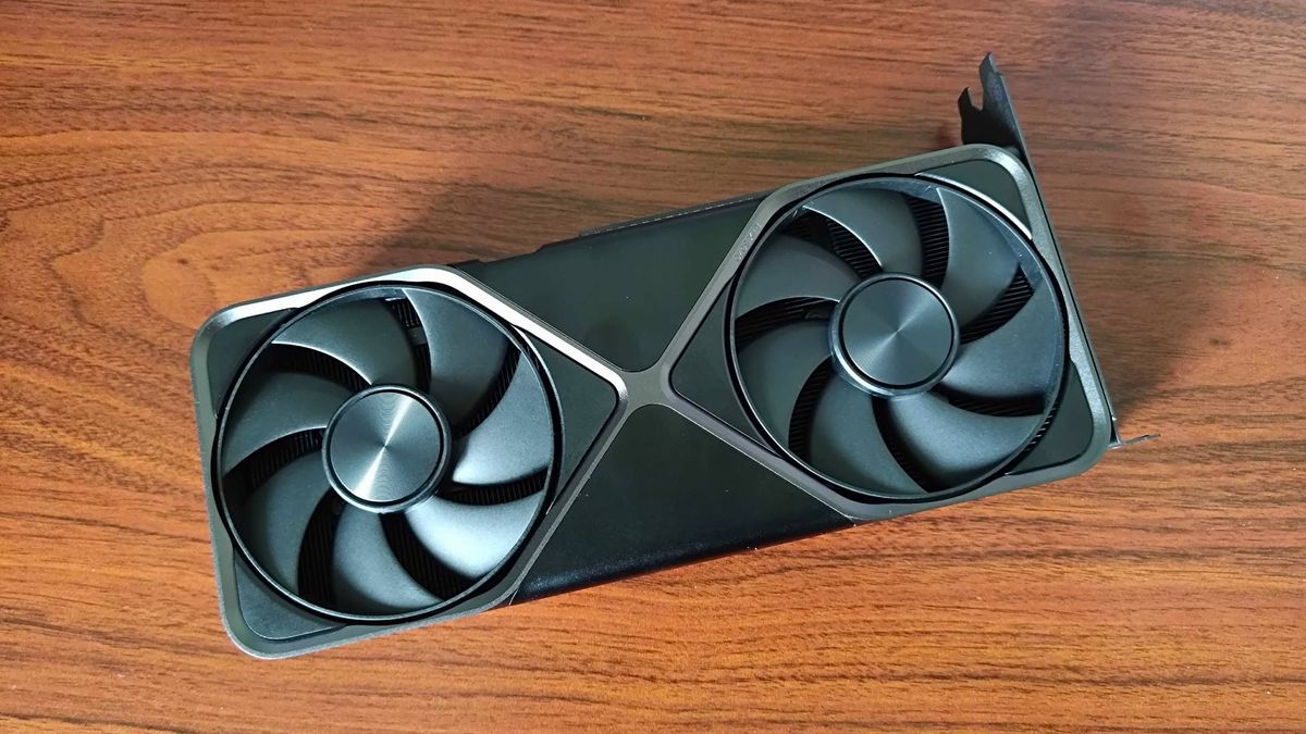 RTX 5070 Founders Edition with fans facing upwards on woodgrain desk