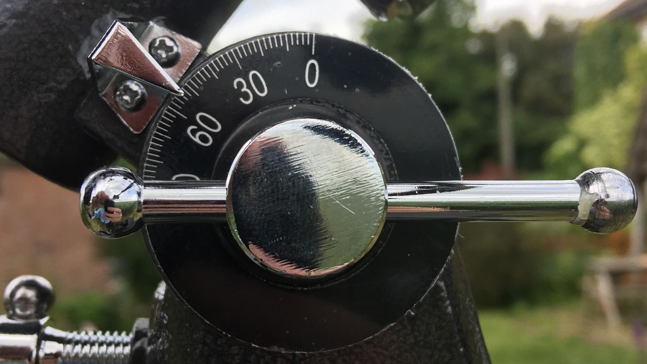 Image shows a close up of the lattitude setting arc