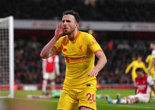 Liverpool’s Diogo Jota celebrates scoring their side’s first goal of the game during the Premier League match at the Emirates Stadium, London. Picture date: Wednesday March 16, 2022