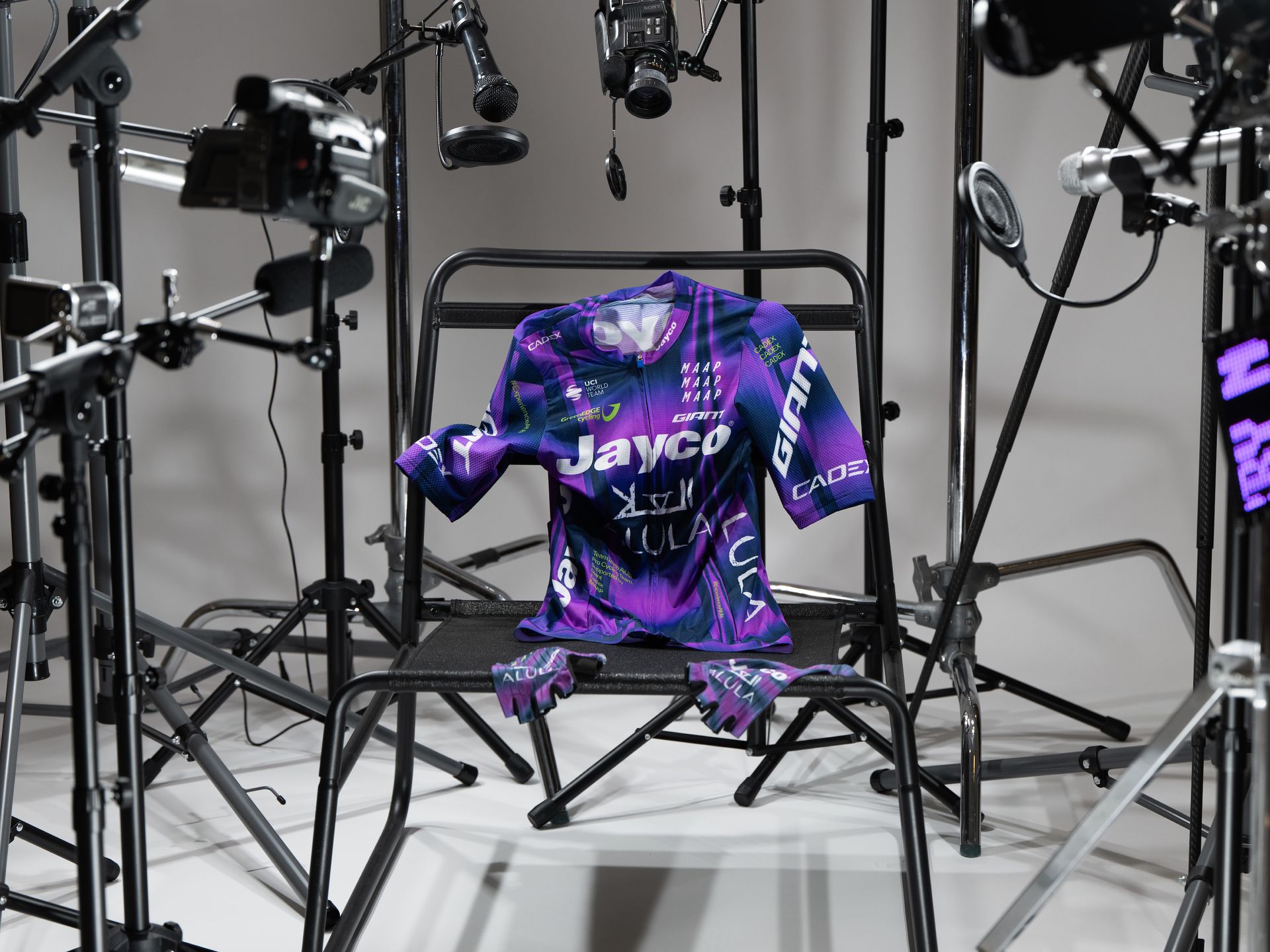 The new MAAP Jayco AlUla kit, a largely purple jersey with green flashes, paired with grey shorts