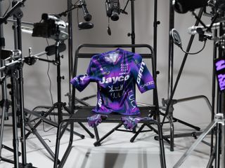 The new MAAP Jayco AlUla kit, a largely purple jersey with green flashes, paired with grey shorts