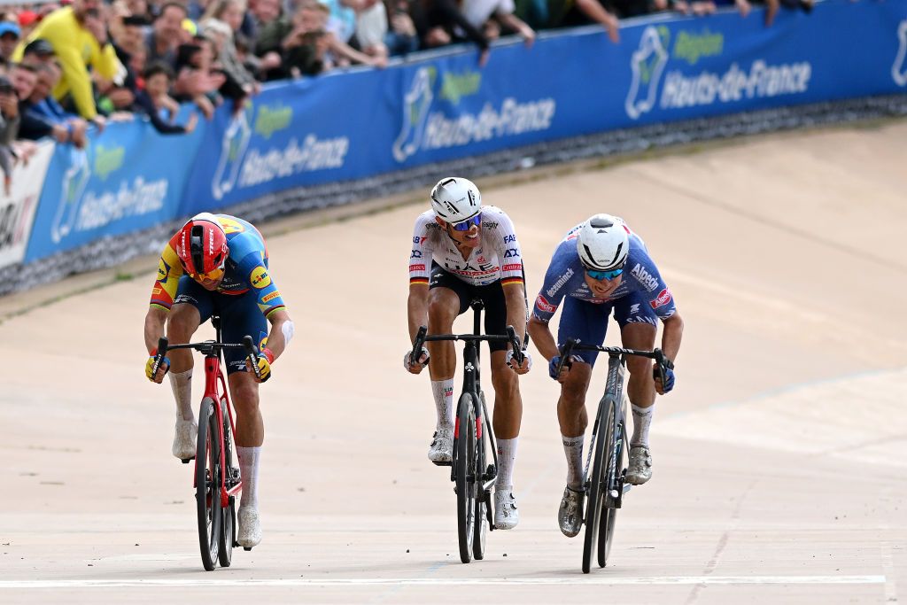 ROUBAIX FRANCE APRIL 07 LR Mads Pedersen of Denmark and Team Lidl Trek Nils Politt of Germany and UAE Team Emirates and Jasper Philipsen of Belgium and Team Alpecin Deceuninck sprint at finish line during the 121st ParisRoubaix 2024 a 2597km one day race from Compiegne to Roubaix UCIWT Roubaix Velodrome Velodrome Andre Petrieux on April 07 2024 in Roubaix France Photo by Dario BelingheriGetty Images