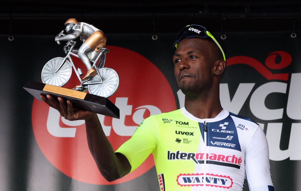 Eritrean Biniam Girmay Hailu of Intermarche-Wanty celebrates on the podium after winning the Circuit Franco-Belge cycling race, 190,6 km from Tournai to Mont-de-l'Enclus, stage 6 (out of 9) of the Lotto Cycling Cup, Wednesday 29 May 2024. BELGA PHOTO VIRGINIE LEFOUR (Photo by VIRGINIE LEFOUR / BELGA MAG / Belga via AFP)