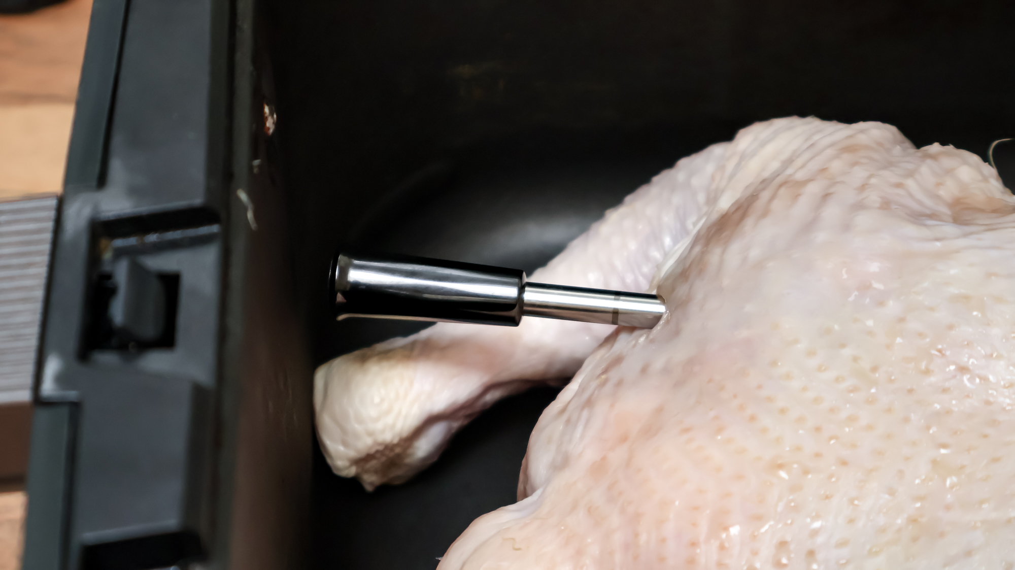 GoveeLife Smart Wireless Meat Thermometer inserted in an uncooked whole chicken